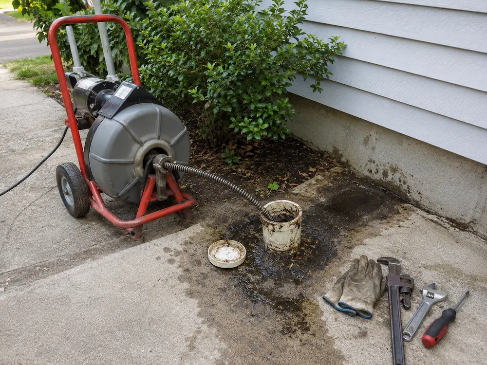 Affordable Plumbing Services sewer backup repair equipment at cleanout